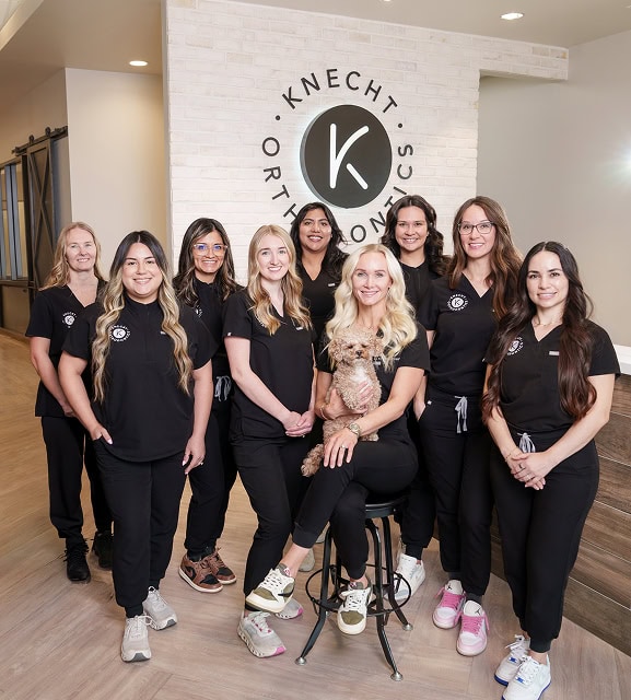 Dr. Kristen Knecht and the Knecht Orthodontics team in the office lobby