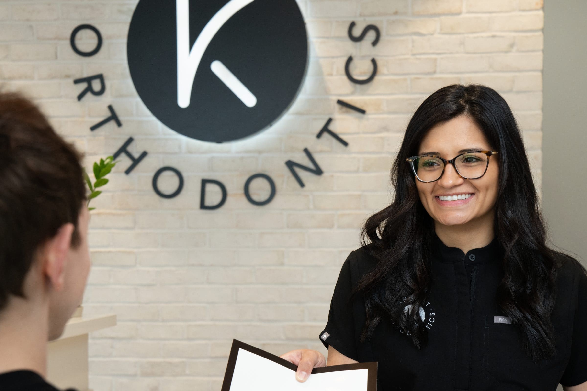 Knecht Orthodontics team member greeting a patient