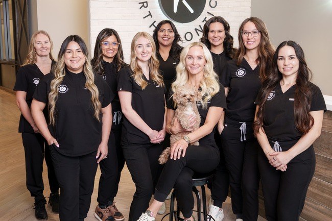 The Knecht Orthodontics team with Dr. Kristen Knecht in the office lobby